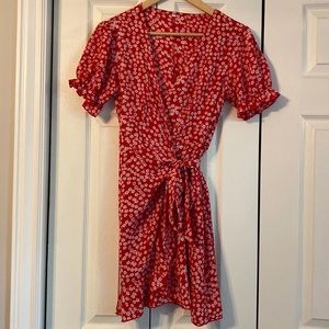 Size medium red and white floral dress. Ties in front. 100% polyester.